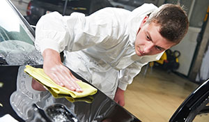 aluminum-truck-frame-repair-1-300w-WEB Technician providing car detailing services on vehicle hood